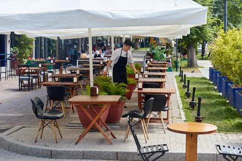 An empty table of an outdoor cafe Stock Photos