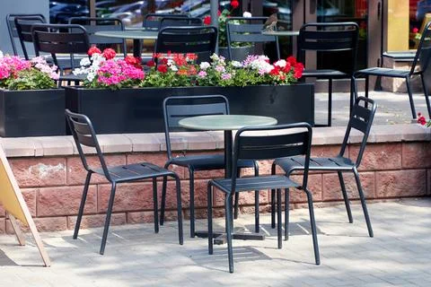 An empty table of an outdoor cafe Stock Photos