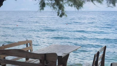 Empty table in the restaurant next to the beach Video stock 137804477