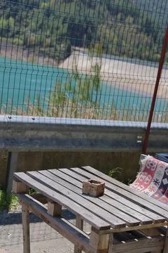 An empty table at a roadside cafe overlooking a reservoir in the Dim Valley,  Stock Photos