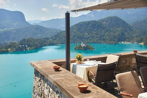 Empty table served with a view of beautiful Lake Bled Stock Photos
