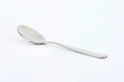 Empty table spoon on white background Stock Photos