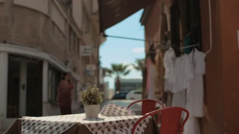 Empty table on terrace of small restaurant. Dynamic video. No visitors. Stock Footage 163208225