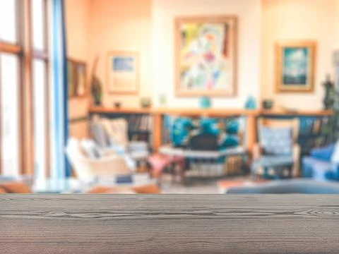The empty table wooden board in front of the background is blurred. Stock Photos