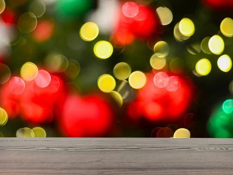 The empty table wooden board in front of the background is blurred. Stock Photos
