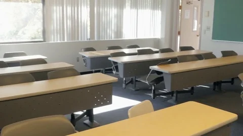 Empty Tables and Chairs in Abandoned Classroom Stock Footage 80748862