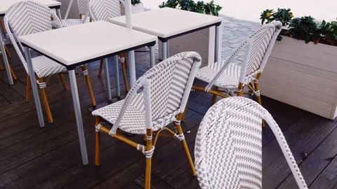 Empty tables and chairs in cafe outdoors, pandemic and hospitality industry Stock Footage 140370311