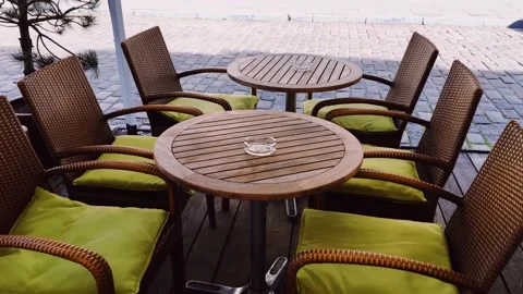 Empty tables and chairs in cafe outdoors, pandemic and hospitality industry Stock Footage 140413389