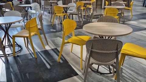 Empty tables and chairs of a cafe during the day without customers 스톡 동영상 301909995