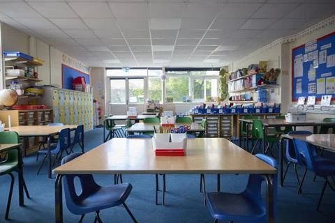 Empty Tables And Chairs In Primary Or Elementary School Classroom Stock Photos