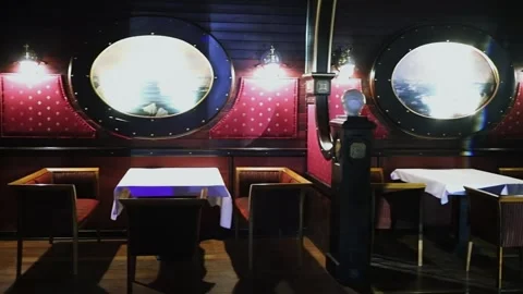 Empty tables are in dark cafe during Award Records of real estate market 2017 in Stock Footage 276371897