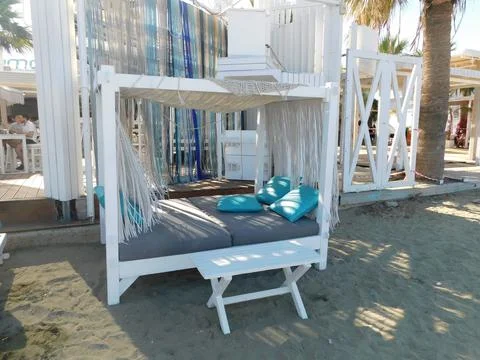 Empty tables in a cafe on the beach. Larnaca. Cyprus Stock Photos