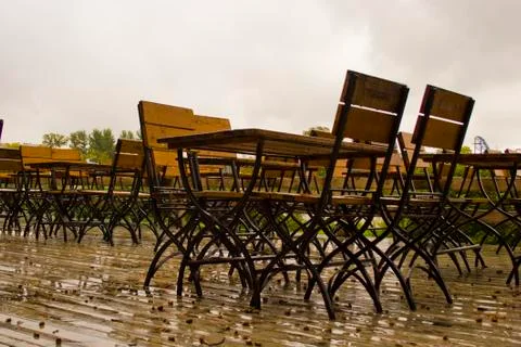 Empty tables in a cafe in the rain Stock Photos