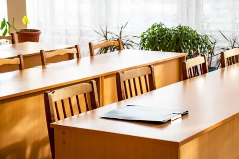 Empty tables in the classroom Stock Photos