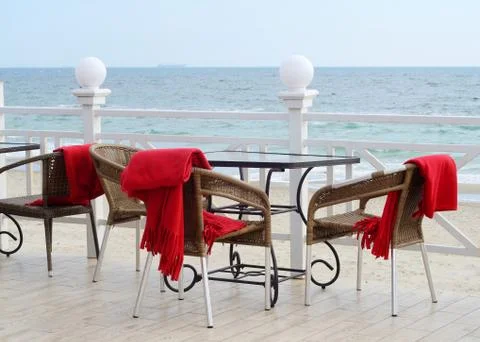 Empty tables at hotel restaurant with red plaids on Black Sea coast,Odessa Stock Photos
