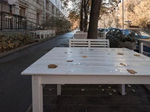 Empty tables at sidewalk cafe or reustaurant. Stock Photos