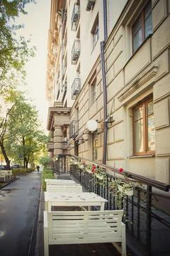 Empty tables at sidewalk cafe or reustaurant. Stock Photos