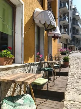 Empty tables in a small street cafe. Varna. Bulgaria. Stock-Fotos