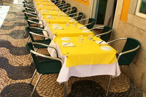 Empty tables in street cafe Stock Photos