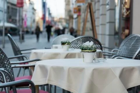 Empty tables on the street Stock-Fotos