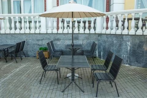 Empty tables in a summer cafe Stock Photos