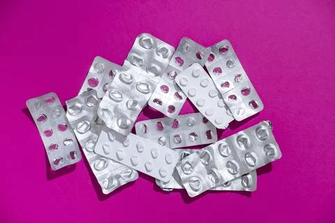 Empty tablet blister pack against a monochrome background top view Stock Photos