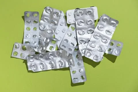 Empty tablet blister pack against a monochrome background top view Stock Photos
