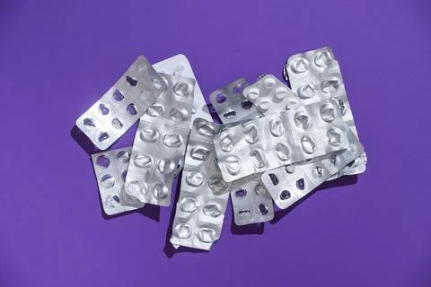 Empty tablet blister pack against a monochrome background top view Stock Photos