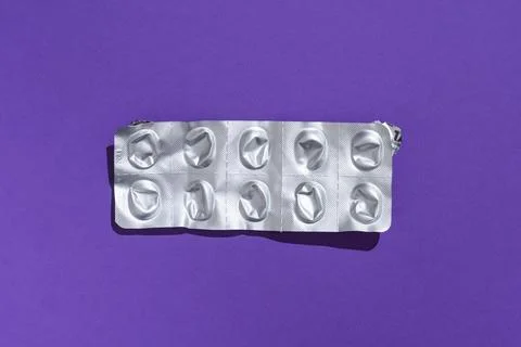 Empty tablet blister pack against a monochrome background top view Stock Photos