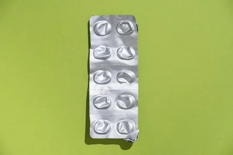 Empty tablet blister pack against a monochrome background top view Stock Photos