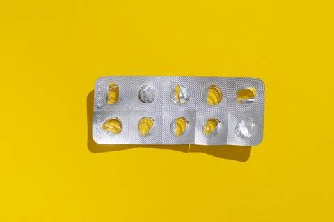Empty tablet blister pack against a monochrome background top view Stock Photos