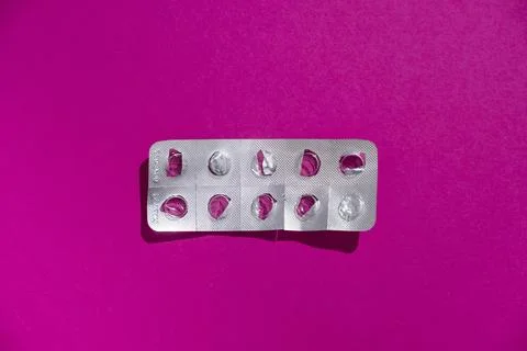 Empty tablet blister pack against a monochrome background top view Stock Photos
