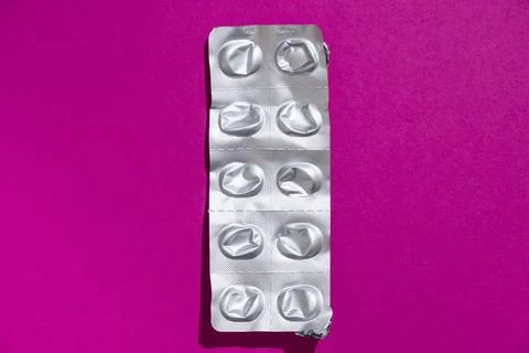 Empty tablet blister pack against a monochrome background top view Stock Photos