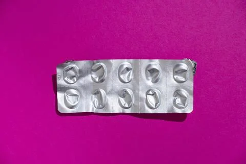 Empty tablet blister pack against a monochrome background top view Stock Photos