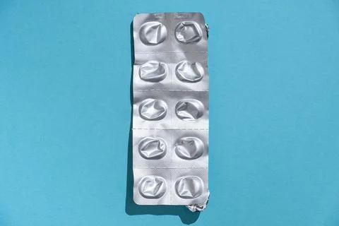 Empty tablet blister pack against a monochrome background top view Stock Photos