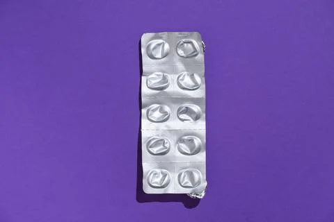 Empty tablet blister pack against a monochrome background top view Stock Photos