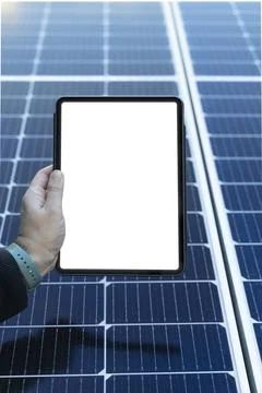 Empty tablet with copy space with some solar panels on the background Stock Photos