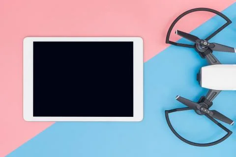 Empty tablet mock up with drone on blue pink background Stock Photos