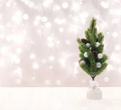 Empty tabletop with Christmas tree on a bright background with bokeh light... Stock Photos