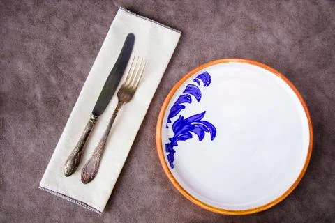 Empty tableware and dishware settings and serving on the gray background Foto stock