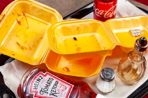 Empty take away cartons on a tray with a drink can 스톡 사진
