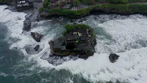 Empty Tanah Lot temple on dark rocky cliff at sea during covid lockdown time Stock Footage 160302884