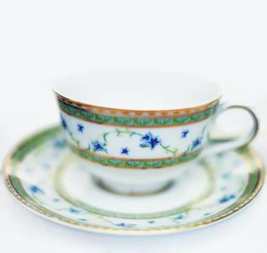 Empty, tea cup and closeup of crockery in studio, white background and sauc.. Stock Photos