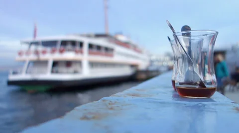 Empty tea glasses with a passenger boat at the background in Istanbul turkey Video stock 34215245