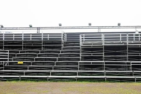 An empty temporary installation stage on an outdoor field Stock Photos