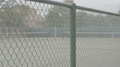Empty tennis court on a rainy day Stock Footage