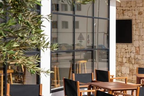 Empty terrace of a rustic hotel in a small town with copy space. Tourism co.. Stock Photos