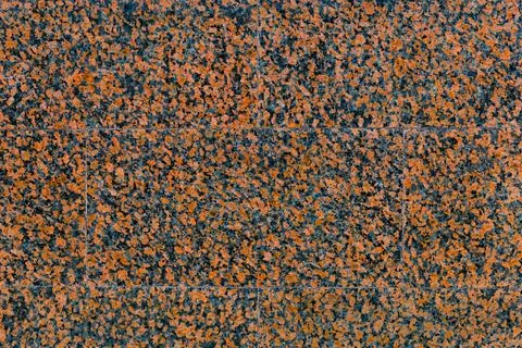 Empty texture of the wall with facing tile of red, spotted marble Foto stock