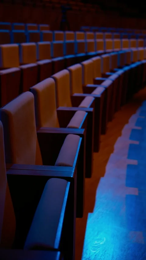 Empty theater chairs in rows under blue light Stock-Footage 323130204