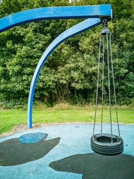 Empty Tire Swing in a Playground Stock Photos
